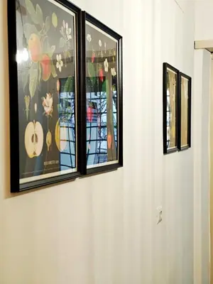 two windows on a wall with paintings on it at DOMUS Villa Chigi in Rome