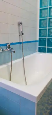 a bath tub with a shower in a bathroom at Leila Stazione Tiburtina 10 minuti dal Coloseo in Rome