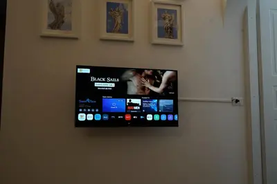 a flat screen tv hanging on a wall at Appartamento Vaticano Metro A in Rome