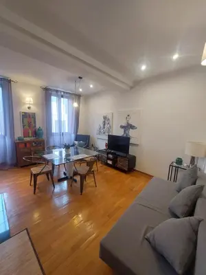 a living room with a couch and a table at Exclusive Flat Piazza di Spagna in Rome