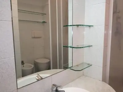 a bathroom with a sink and a mirror at Fabio's Home Gemelli in Rome