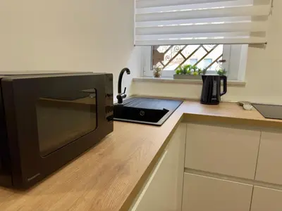 a microwave oven sitting on a counter in a kitchen at Trastevere alla Lungaretta, Rome in Rome