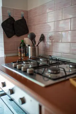 a stove top oven sitting in a kitchen at La casa di Gegè Appio Caffarella in Rome