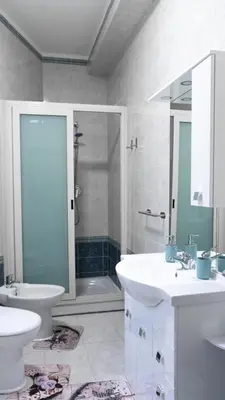 a bathroom with a sink and a toilet and a shower at Casa Noemi in Rome
