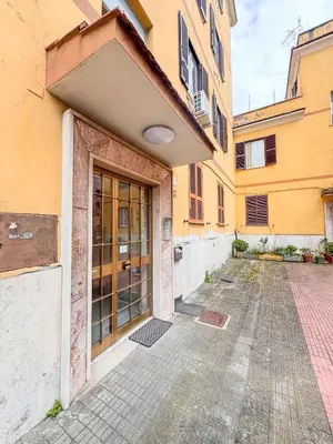 an entrance to a building with a large glass door at Casa Noemi in Rome