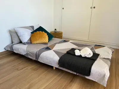 a bed with two towels on it in a room at Attico Vacanza Roma Nord - Casa Mengotti in Rome