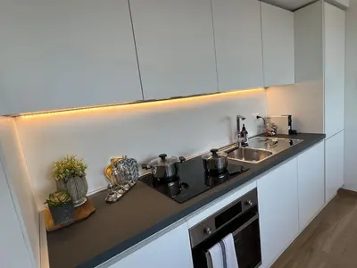 a kitchen with a sink and a counter top at Attico Vacanza Roma Nord - Casa Mengotti in Rome