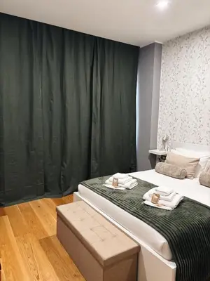 a bedroom with two beds with towels on them at Twentythree Luxury Apartment in Rome