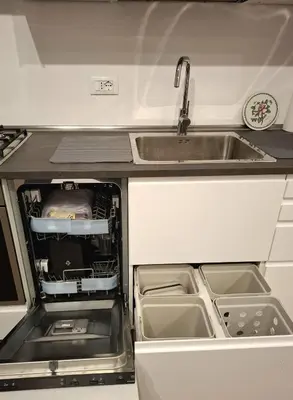 an open kitchen with a sink and a sink at DimorAlexis, the house in front of Vatican's walls in Rome