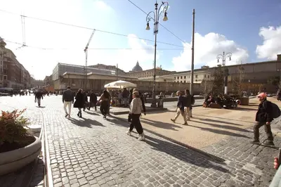 a group of people walking down a street at Ottaviano 2BR Holiday House in Rome