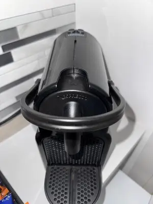 a black computer mouse sitting on top of a table at Piignetoo Apartment in Rome