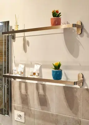 a shelf with plants on top of a wall at 10 Minuti Stazione Trastevere - Atelier 19 1BDR by Hôtea in Rome