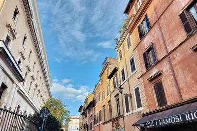 a group of buildings on a city street at Trastevere Historic Loft by Luxury Getaways in Rome