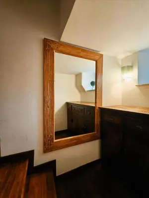 a mirror on a wall in a room at Piccolo Attico in Rome