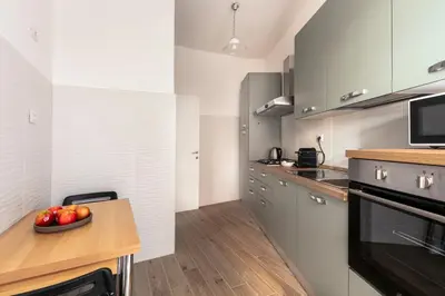 a kitchen with a bowl of fruit on a counter at Casa Laberio by Hili in Rome