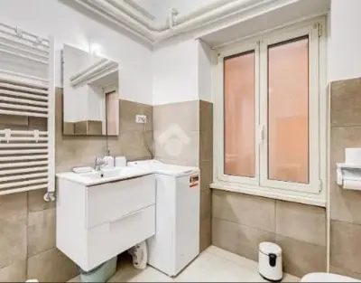 a bathroom with a sink and a mirror at Casa Vulture in Rome
