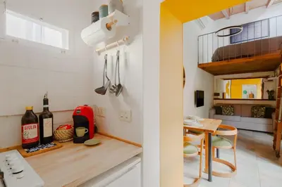a small kitchen with a table and a dining room at Casa Piccinino in Rome