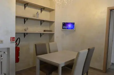 a dining room with a table and chairs at Locazione turistica di Carlo in Rome
