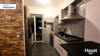 a kitchen with a stove and a counter top at Poetry House in Rome