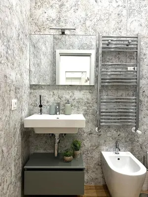 a bathroom with a sink and a mirror at The Temple Apartment in Rome