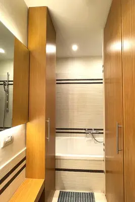 a bathroom with a bath tub and a shower at Di casa al Colosseo in Rome