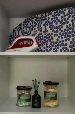 a shelf with two jars and a toy car on it at Trastevere Luxury Studio in Rome