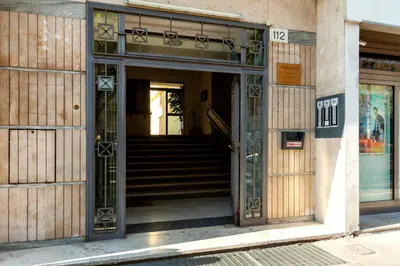 an open door of a building with stairs at La casetta di Trastevere in Rome