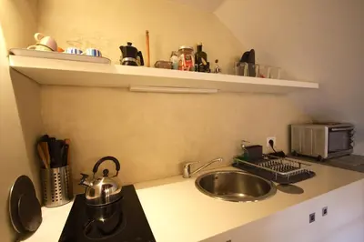 a kitchen with a sink and a counter top at Il Nido sui Tetti di Piazza Navona in Rome