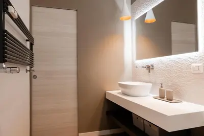 a bathroom with a white sink and a mirror at Domus Solis in Rome