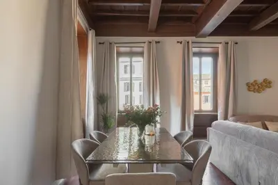 a dining room with a table and chairs at iFlat Trastevere Life with Beauty, Elegance & SPA in Rome