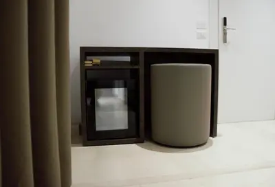 a trash can in a room with a mirror at Domus Dea Roma by Trinità in Rome