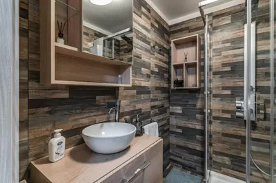 a bathroom with a sink and a shower at Fresh House Sapienza in Rome