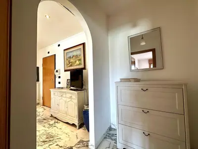 a hallway with a dresser and a mirror at The Vatican Studio in Rome