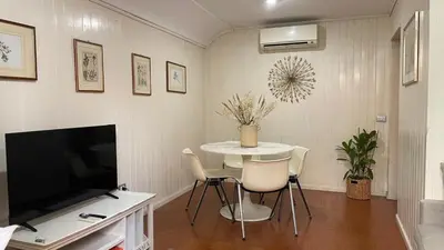 a living room with a table and a television at Appia apartment in Rome