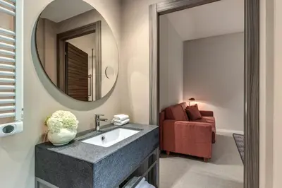 a bathroom with a sink and a mirror at Parioli Cube Hotel in Rome