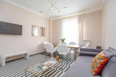 a living room with a couch and a table at Daplace - Cosima Apartment III in Rome