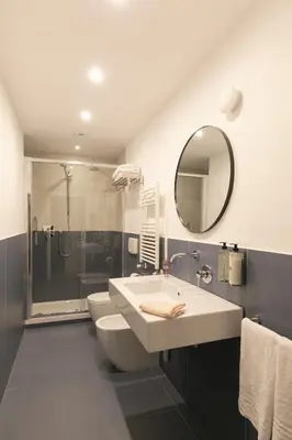 a bathroom with a toilet and a sink and a shower at Off in Rome