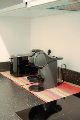 a sewing machine sitting on top of a counter at Quiet and cosy central apartment in Rome