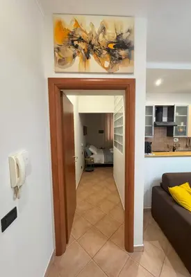 a hallway leading into a living room with a couch at Milena's Home Rome Center in Rome
