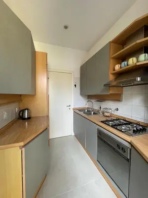 a kitchen with a sink and a stove top oven at San Giovanni Apartment Rome in Rome