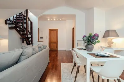 a living room with a couch and a table at Sweet Heaven Apartment in Rome
