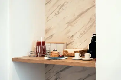 a table with a cake and candles on a shelf at Sweet Heaven Apartment in Rome