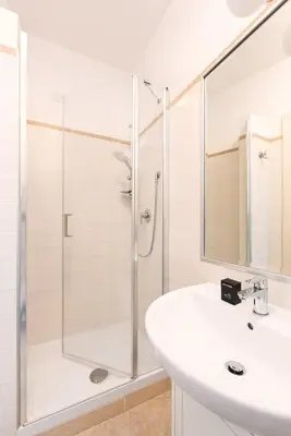a bathroom with a shower and a sink at Idyllia - Spacious bright flat in Rome