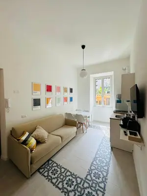 a living room with a couch and a table at Gattamelata in Rome