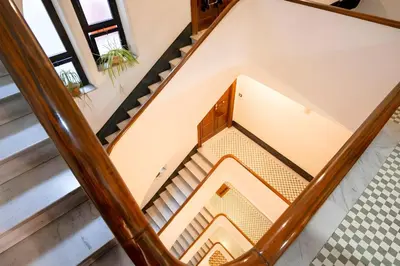 an overhead view of a staircase in a house at Elegantis Solinda Suite Apartment with Private Terrace - Steps from Metro, Tram & Bus to Rome's Historic Center in Rome