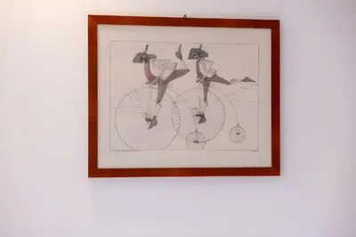 a drawing of a bicycle in a framed picture at Elegantis Solinda Suite Apartment with Private Terrace - Steps from Metro, Tram & Bus to Rome's Historic Center in Rome