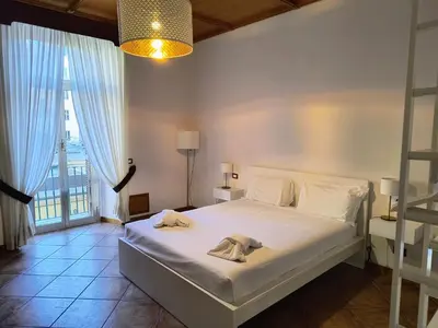 a bedroom with a bed with towels on it at The Apartment in Rome