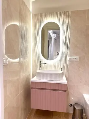 a bathroom with a sink and a mirror at Maryam Vatican Suites in Rome