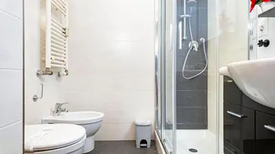 a bathroom with a shower and a toilet and a sink at Il Sogno Romano in Rome