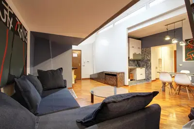 a living room with a couch and a table at San Lorenzo Elegante loft in Rome